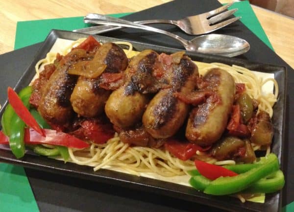 Italian sausage and peppers skillet on serving platter