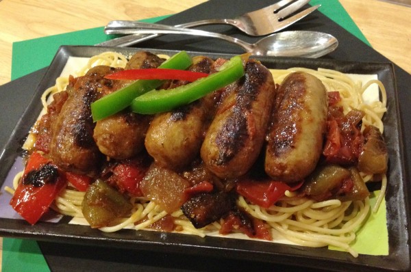 Italian sausage and peppers skillet on serving platter